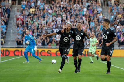 Aug 20, 2022; Saint Paul, Minnesota, USA; Minnesota United midfielder Emanuel Reynoso (10) is congratulated by midfielder Franco Fragapane (7) and forward Luis Amarilla (9) after scoring a penalty kick against Austin FC goalkeeper Brad Stuver (1) in the first half at Allianz Field. Mandatory Credit: Matt Blewett-USA TODAY Sports