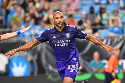 Aug 21, 2022; Charlotte, North Carolina, USA; Orlando City forward Tesho Akindele (13) reacts after scoring the winning goal in the second half at Bank of America Stadium. Mandatory Credit: Bob Donnan-USA TODAY Sports