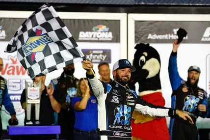 Aug 26, 2022; Daytona Beach, Florida, USA;  NASCAR Xfinity Series driver Jeremy Clements (51) celebrates in victory lane after winning the Wawa 250 at Daytona International Speedway. Mandatory Credit: John David Mercer-USA TODAY Sports