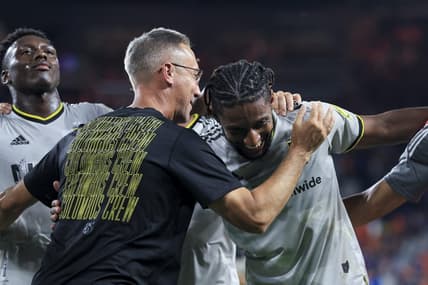 Aug 27, 2022; Cincinnati, Ohio, USA;  Columbus Crew SC head coach Caleb Porter (left) hugs defender Steven Moreira as they celebrate after the game against FC Cincinnati at TQL Stadium. Mandatory Credit: Aaron Doster-USA TODAY Sports