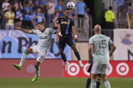 Aug 31, 2022; Chester, Pennsylvania, USA; Philadelphia Union midfielder Jose Andres Martinez (8) heads the ball against Atlanta United forward Ronaldo Cisneros (29) in the first half at Subaru Park. Mandatory Credit: Mitchell Leff-USA TODAY Sports