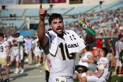 Wake Forest Demon Deacons quarterback Sam Hartman (10) gets ready to celebrate during the fourth quarter Friday, Dec. 31, 2021 at TIAA Bank Field in Jacksonville. The Wake Forest Demon Deacons and the Rutgers Scarlet Knights faced each other in the 2021 TaxSlayer Gator Bowl. Wake Forest defeated Rutgers 38-10. [Corey Perrine/Florida Times-Union]