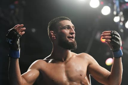 Apr 9, 2022; Jacksonville, Florida, USA;  Khamzat Chimaev (blue gloves) after a fight against Gilbert Burns (red gloves) during UFC 273 at VyStar Veterans Memorial Arena. Mandatory Credit: David Yeazell-USA TODAY Sports