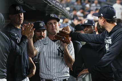 Jun 16, 2022; Bronx, New York, USA; New York Yankees relief pitcher Ryan Weber (85) is congratulated by teammates after being relieved from the game during the seventh inning against the Tampa Bay Rays at Yankee Stadium. Mandatory Credit: Vincent Carchietta-USA TODAY Sports