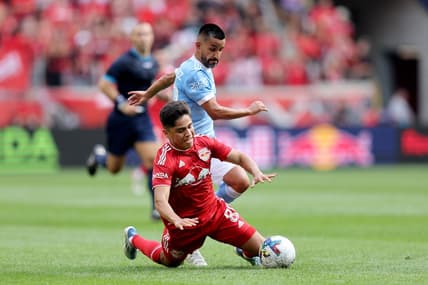 Jul 17, 2022; Harrison, New Jersey, USA; New York City midfielder Maximiliano Moralez (10) and New York Red Bulls midfielder Frankie Amaya (8) fight for the ball during the first half at Red Bull Arena. Mandatory Credit: Brad Penner-USA TODAY Sports