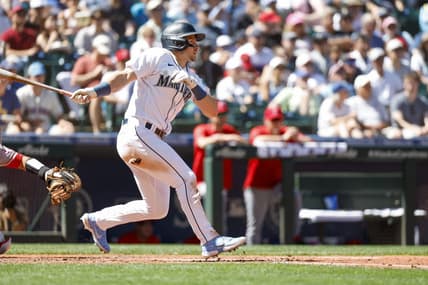 Aug 6, 2022; Seattle, Washington, USA; Seattle Mariners center fielder Jarred Kelenic (10) hits a single against the Los Angeles Angels during the fifth inning at T-Mobile Park. Mandatory Credit: Joe Nicholson-USA TODAY Sports