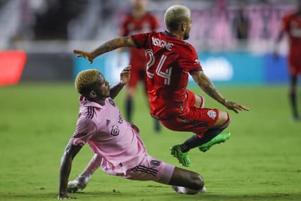 Aug 20, 2022; Fort Lauderdale, Florida, USA; Toronto FC forward Lorenzo Insigne (24) gets fouled by Inter Miami CF defender DeAndre Yedlin (2) during the second half at DRV PNK Stadium. Mandatory Credit: Sam Navarro-USA TODAY Sports