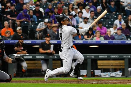 Aug 20, 2022; Denver, Colorado, USA; Colorado Rockies left fielder Connor Joe (9) looks up at the ball during his at bat agains the San Francisco Giants at Coors Field. Mandatory Credit: John Leyba-USA TODAY Sports