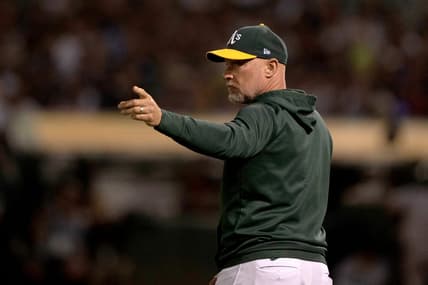 Aug 25, 2022; Oakland, California, USA;  Oakland Athletics manager Mark Kotsay (7) signals during the third inning against the New York Yankees at RingCentral Coliseum. Mandatory Credit: Stan Szeto-USA TODAY Sports