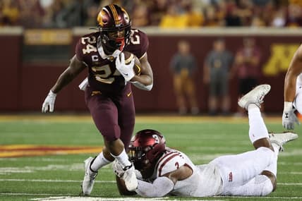 Sep 1, 2022; Minneapolis, Minnesota, USA; Minnesota Golden Gophers running back Mohamed Ibrahim (24) breaks a tackle from New Mexico State Aggies linebacker Chris Ojoh (3) during the first quarter at Huntington Bank Stadium. Mandatory Credit: Matt Krohn-USA TODAY Sports