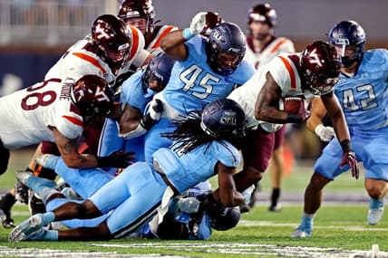 Sep 2, 2022; Norfolk, Virginia, USA;  Virginia Tech Hokies running back Jalen Holston (0) runs the ball during the second quarter against Old Dominion Monarchs defensive tackle Denzel Lowry (45) at Kornblau Field at S.B. Ballard Stadium. Mandatory Credit: Peter Casey-USA TODAY Sports