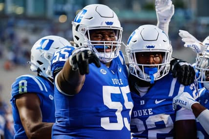 Sep 2, 2022; Durham, North Carolina, USA;  Duke Blue Devils offensive lineman Andre Harris (55) and Duke Blue Devils running back Jaylen Coleman (22) celebrate during first half of the game against Temple University at Wallace Wade Stadium. Mandatory Credit: Jaylynn Nash-USA TODAY Sports