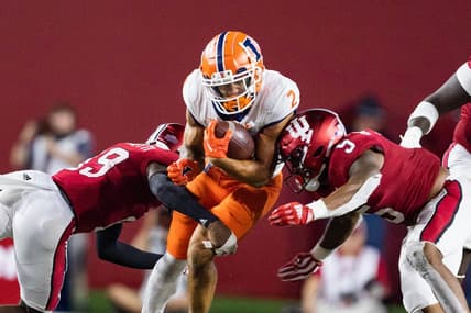 Sep 2, 2022; Bloomington, Indiana, USA; Illinois Fighting Illini running back Chase Brown (2) runs the ball while Indiana Hoosiers defensive back Josh Sanguinetti (19) defends in the second half at Memorial Stadium. Mandatory Credit: Trevor Ruszkowski-USA TODAY Sports