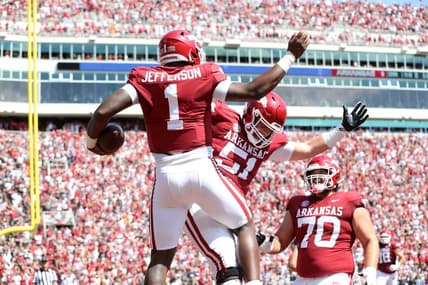 Sep 3, 2022; Fayetteville, Arkansas, USA; Arkansas Razorbacks quarterback KJ Jefferson (1) celebrates with offensive lineman Ricky Stromberg (51) and Luke Jones (70) after rushing for a touchdown in the first quarter against the Cincinnati Bearcats at Donald W. Reynolds Razorback Stadium. Mandatory Credit: Nelson Chenault-USA TODAY Sports