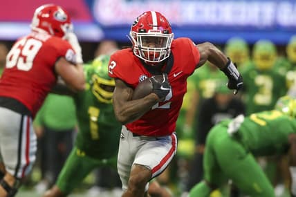Sep 3, 2022; Atlanta, Georgia, USA; Georgia Bulldogs running back Kendall Milton (2) runs the ball against the Oregon Ducks in the second quarter at Mercedes-Benz Stadium. Mandatory Credit: Brett Davis-USA TODAY Sports
