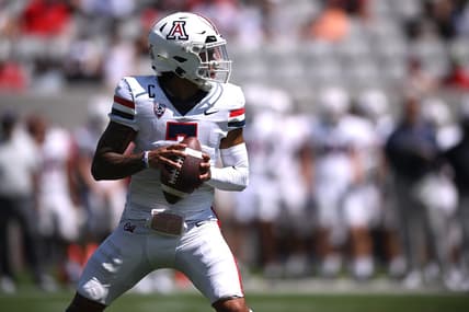 Sep 3, 2022; San Diego, California, USA; Arizona Wildcats quarterback Jayden de Laura (7) looks to pass against the San Diego State Aztecs during the first half at Snapdragon Stadium. Mandatory Credit: Orlando Ramirez-USA TODAY Sports