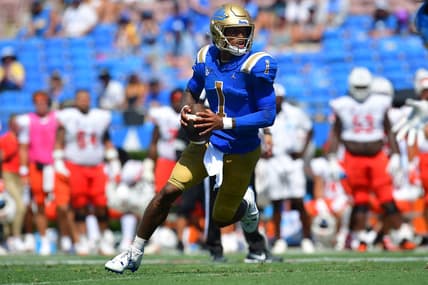 Sep 3, 2022; Pasadena, California, USA; UCLA Bruins quarterback Dorian Thompson-Robinson (1) moves out to pass against the Bowling Green Falcons during the second half at Rose Bowl. Mandatory Credit: Gary A. Vasquez-USA TODAY Sports