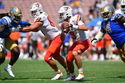 Sep 3, 2022; Pasadena, California, USA; Bowling Green Falcons quarterback Matt McDonald (3) runs the ball as UCLA Bruins defensive lineman Martin Andrus Jr. (44)  and linebacker Carl Jones Jr. (35) move in with tight end Andrew Bench (89) providing coverage during the second half at Rose Bowl. Mandatory Credit: Gary A. Vasquez-USA TODAY Sports