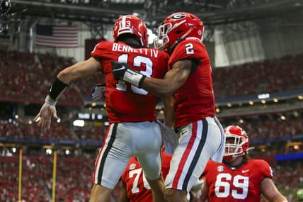 Sep 3, 2022; Atlanta, Georgia, USA; Georgia Bulldogs quarterback Stetson Bennett (13) celebrates with running back Kendall Milton (2) after a touchdown run against the Oregon Ducks in the second quarter at Mercedes-Benz Stadium. Mandatory Credit: Brett Davis-USA TODAY Sports