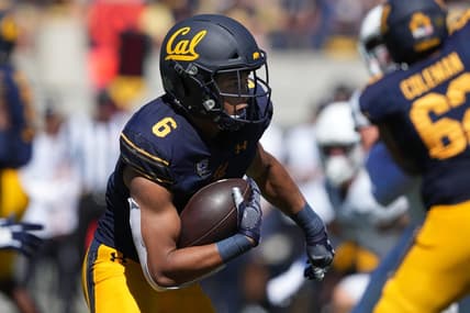 Sep 3, 2022; Berkeley, California, USA; California Golden Bears running back Jaydn Ott (6) carries the ball against the UC Davis Aggies during the third quarter at FTX Field at California Memorial Stadium. Mandatory Credit: Darren Yamashita-USA TODAY Sports