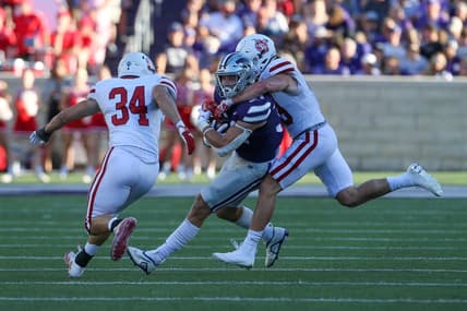 Sep 3, 2022; Manhattan, Kansas, USA; Kansas State Wildcats tight end Ben Sinnott (34) is tackled by South Dakota Coyotes linebacker Stephen Hillis (34) and South Dakota Coyotes linebacker Gage Tennyson (38) during the first quarter at Bill Snyder Family Football Stadium. Mandatory Credit: Scott Sewell-USA TODAY Sports