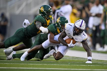 Sep 3, 2022; Waco, Texas, USA; Albany Great Danes wide receiver Julian Hicks (1) is tackled by Baylor Bears safety Al Walcott (13) during the second quarter at McLane Stadium. Mandatory Credit: Jerome Miron-USA TODAY Sports