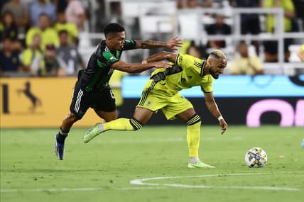 Sep 3, 2022; Nashville, Tennessee, USA;  Nashville SC midfielder Hany Mukhtar (10) gets pushed by Austin FC midfielder Daniel Pereira (6) in the first half at Geodis Park. Mandatory Credit: Casey Gower-USA TODAY Sports