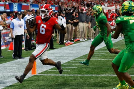 Georgia running back Kenny McIntosh (6) drives in for touchdown during the first half of the Chick-fil-A Kickoff Game between Oregon and Georgia in Atlanta, on Saturday, Sept. 3, 2022.

News Joshua L Jones