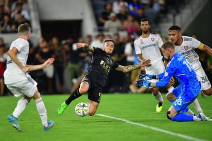 Sep 4, 2022; Los Angeles, California, USA; Los Angeles FC forward Cristian Arango (9) moves in for a shot against Real Salt Lake goalkeeper Zac MacMath (18) and defender Marcelo Silva (30) during the first half at Banc of California Stadium. Mandatory Credit: Gary A. Vasquez-USA TODAY Sports