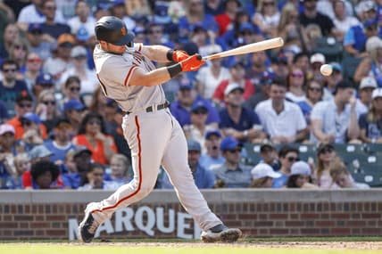 Sep 10, 2022; Chicago, Illinois, USA; San Francisco Giants catcher Joey Bart (21) singles against the Chicago Cubs during the ninth inning at Wrigley Field. Mandatory Credit: Kamil Krzaczynski-USA TODAY Sports
