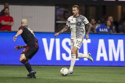 Sep 10, 2022; Atlanta, Georgia, USA; Toronto FC forward Federico Bernardeschi (10) controls the ball against Atlanta United defender Andrew Gutman (15) in the first half at Mercedes-Benz Stadium. Mandatory Credit: Brett Davis-USA TODAY Sports