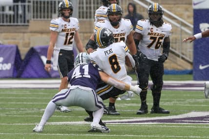 Sep 10, 2022; Manhattan, Kansas, USA; Missouri Tigers running back Nathaniel Peat (8) is tackled by Kansas State Wildcats linebacker Austin Moore (41) during the fourth quarter at Bill Snyder Family Football Stadium. Mandatory Credit: Scott Sewell-USA TODAY Sports
