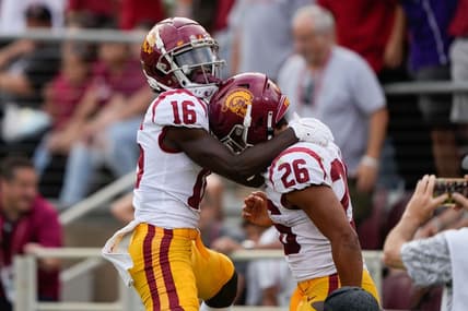 Sep 10, 2022; Stanford, California, USA;  USC Trojans wide receiver Tahj Washington (16) and running back Travis Dye (26) celebrate during the second quarter against the Stanford Cardinal at Stanford Stadium. Mandatory Credit: Stan Szeto-USA TODAY Sports