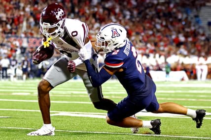 Sep 10, 2022; Tucson, Arizona, USA; Mississippi State Bulldogs wide receiver Rara Thomas (0) runs the ball against Arizona Wildcats cornerback Isaiah Rutherford (2) during the first half at Arizona Stadium. Mandatory Credit: Mark J. Rebilas-USA TODAY Sports