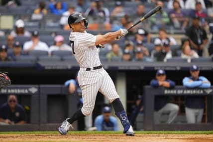Sep 11, 2022; Bronx, New York, USA; New York Yankees designated hitter Giancarlo Stanton (27) hits a three run home run against the Tampa Bay Rays during the second inning at Yankee Stadium. Mandatory Credit: Gregory Fisher-USA TODAY Sports