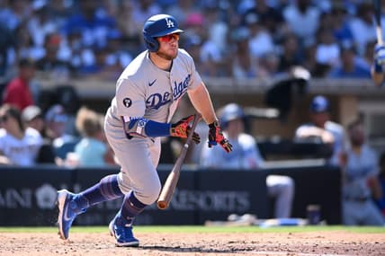 Sep 11, 2022; San Diego, California, USA; Los Angeles Dodgers designated hitter Max Muncy (13) hits a two-RBI single against the San Diego Padres during the sixth inning at Petco Park. Mandatory Credit: Orlando Ramirez-USA TODAY Sports