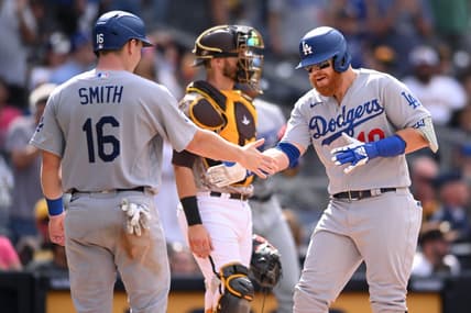 Sep 11, 2022; San Diego, California, USA; Los Angeles Dodgers third baseman Justin Turner (right) is congratulated by designated hitter Will Smith (16) after hitting a grand slam home run against the San Diego Padres during the seventh inning at Petco Park. Mandatory Credit: Orlando Ramirez-USA TODAY Sports