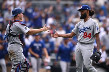 Sep 11, 2022; San Diego, California, USA; Los Angeles Dodgers relief pitcher Andre Jackson (94) and catcher Will Smith (left) celebrate after defeating the San Diego Padres at Petco Park. Mandatory Credit: Orlando Ramirez-USA TODAY Sports