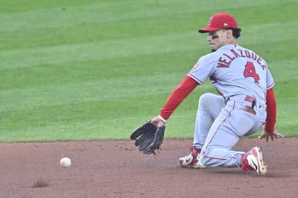 Sep 12, 2022; Cleveland, Ohio, USA; Los Angeles Angels shortstop Andrew Velazquez (4) reaches for the ball in the second inning against the Cleveland Guardians at Progressive Field. Mandatory Credit: David Richard-USA TODAY Sports