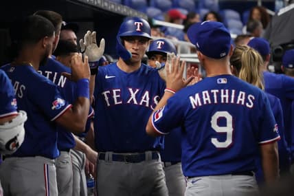 Sep 12, 2022; Miami, Florida, USA; Texas Rangers shortstop Corey Seager (5) celebrates his two-run home run against the Miami Marlins in the seventh inning with teammates at loanDepot park. Mandatory Credit: Jasen Vinlove-USA TODAY Sports