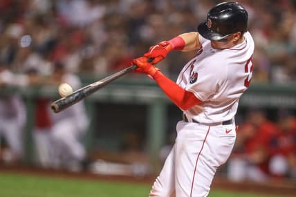 Sep 13, 2022; Boston, Massachusetts, USA; Boston Red Sox catcher Reese McGuire (3) hits a home run during the third inning against the New York Yankees at Fenway Park. Mandatory Credit: Paul Rutherford-USA TODAY Sports