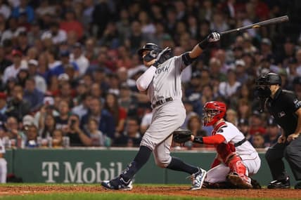 Sep 13, 2022; Boston, Massachusetts, USA; New York Yankees center fielder Aaron Judge (99) hits a home run during the eighth inning against the Boston Red Sox at Fenway Park. Mandatory Credit: Paul Rutherford-USA TODAY Sports