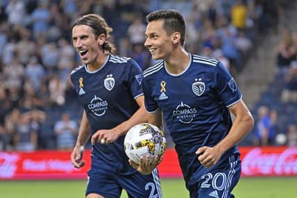 Sep 13, 2022; Kansas City, Kansas, USA; Sporting Kansas City forward Daniel Salloi (20) reacts after scoring a goal against D.C. United during the second half at Children's Mercy Park. Mandatory Credit: Peter Aiken-USA TODAY Sports