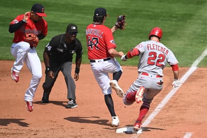 Sep 14, 2022; Cleveland, Ohio, USA; Cleveland Guardians starting pitcher Cal Quantrill (47) forces out Los Angeles Angels shortstop David Fletcher (22) as Guardians second baseman Andres Gimenez, left, tries to stay out of the way during the fifth inning at Progressive Field. Mandatory Credit: Ken Blaze-USA TODAY Sports