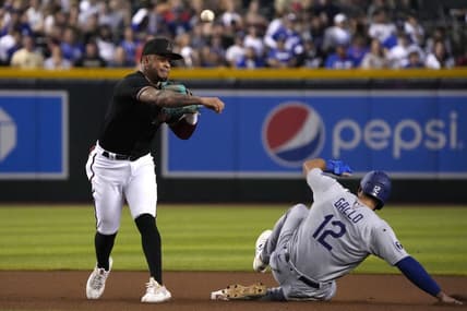 Sep 14, 2022; Phoenix, Arizona, USA; Arizona Diamondbacks second baseman Ketel Marte (4) gets the force out on Los Angeles Dodgers left fielder Joey Gallo (12) in the fourth inning at Chase Field. Mandatory Credit: Rick Scuteri-USA TODAY Sports