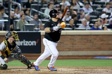 Sep 16, 2022; New York City, New York, USA; New York Mets designated hitter Daniel Vogelbach (32) follows through on a solo home run against the Pittsburgh Pirates during the fourth inning at Citi Field. Mandatory Credit: Brad Penner-USA TODAY Sports