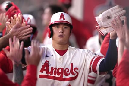 Sep 16, 2022; Anaheim, California, USA; Los Angeles Angels designated hitter Shohei Ohtani (17) is congratulated by teammates after scoring in the first inning against the Seattle Mariners at Angel Stadium. Mandatory Credit: Kirby Lee-USA TODAY Sports