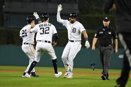 Sep 16, 2022; Detroit, Michigan, USA; Detroit Tigers right fielder Victor Reyes (22)  celebrates with shortstop Javier Baez (28)  and third baseman Ryan Kreidler (32) after hitting a sacrifice fly to score the game-winning run against the Chicago White Sox in the tenth inning at Comerica Park. Mandatory Credit: Lon Horwedel-USA TODAY Sports