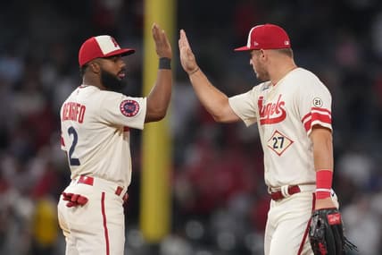 Sep 16, 2022; Anaheim, California, USA; Los Angeles Angels center fielder Mike Trout (27) and second baseman Luis Rengifo (2) celebrate at the end of the game against the Seattle Mariners at Angel Stadium. Mandatory Credit: Kirby Lee-USA TODAY Sports