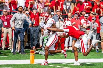 Sep 17, 2022; Lincoln, Nebraska, USA; Oklahoma Sooners wide receiver Jalil Farooq (3) scores a touchdown against Nebraska Cornhuskers defensive back Tommi Hill (0) during the first quarter at Memorial Stadium. Mandatory Credit: Dylan Widger-USA TODAY Sports